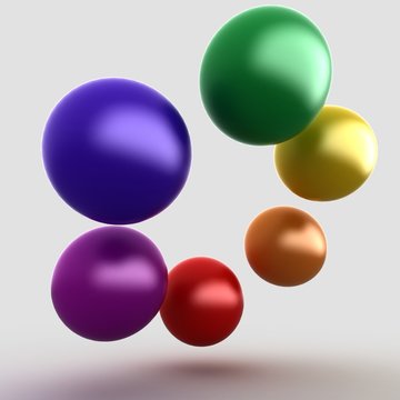 colorful glossy balls on gray