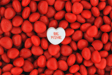 Be Mine Candy on Top of Small Valentine Candies - 76221924