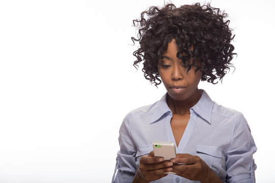 Young African American black woman texting on cellphone