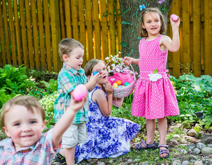 Children Finding Eggs on an Easter Egg Hunt - 76222166