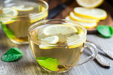 Cup with mint and lemon tea