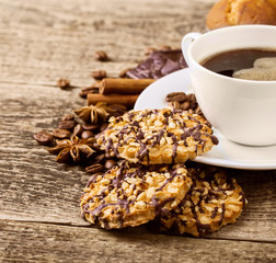 coffee and cookies on wood background