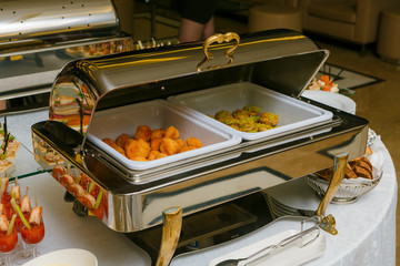 Catering - served table with nuggets and other hot snacks