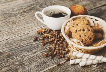 coffee and cookies on wood background
