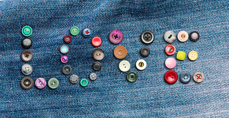 Many colorful buttons forming the word 'love'