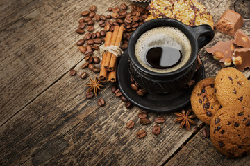 coffee and cookies on wood background
