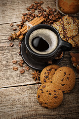 coffee and cookies on wood background