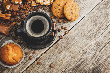 coffee and cookies on wood background