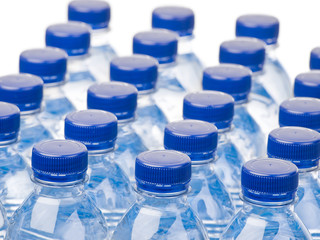 Rows of water bottles on white background