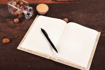Blank recipe book on wooden background