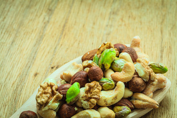 Varieties of nuts: cashew, pistachio, almond.