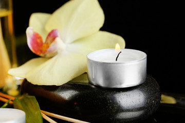 Beautiful spa composition with candle and orchid