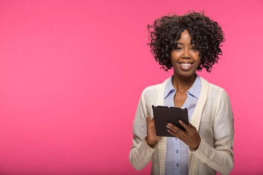Young African American black woman using tablet pc