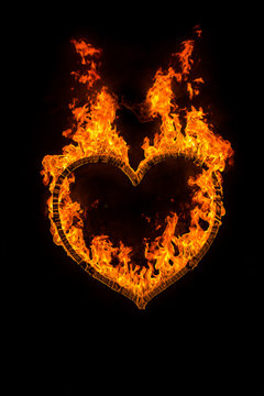 Fire heart at night on black background