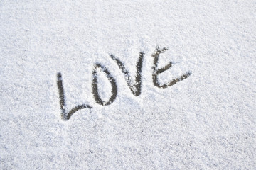 Word love written on fresh snow