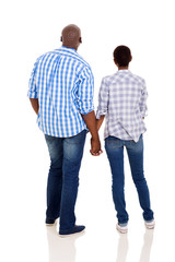 rear view of young african couple holding hands