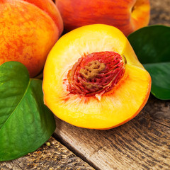 fresh peaches on wood background