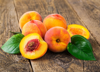 fresh peaches on wood background