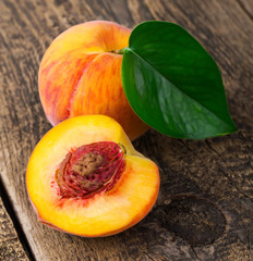 fresh peaches on wood background
