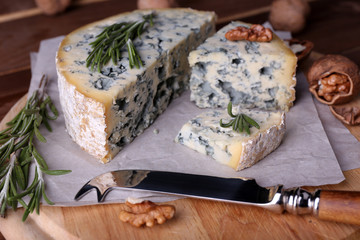 Blue cheese with sprigs of rosemary and nuts
