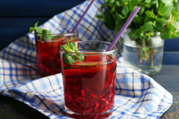 Pomegranate drink in glasses with mint and slices of lime