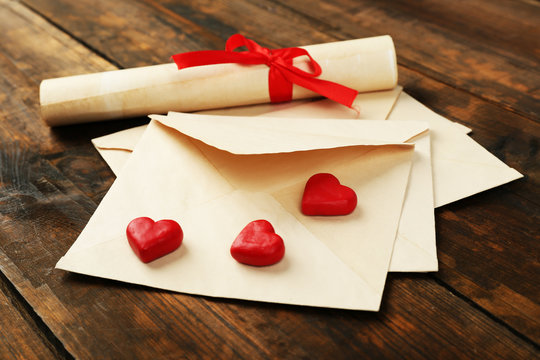 Love letters on rustic wooden table background