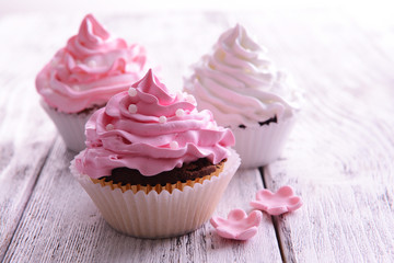 Delicious cupcakes on table close-up