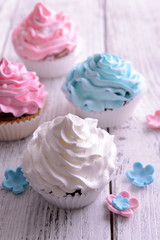 Delicious cupcakes on table close-up