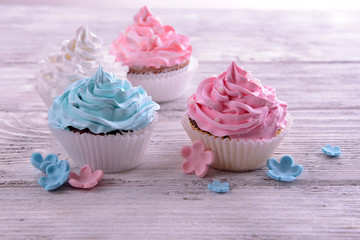 Delicious cupcakes on table close-up
