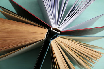 Group of books on colorful background, top view