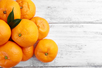 Tangerines on wooden background