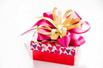 Gold gift box with  ribbon and bow