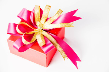 Gold gift box with  ribbon and bow