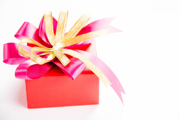 Gold gift box with  ribbon and bow