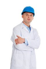 Man in a lab coat and helmet