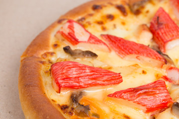 Island Delight pizza on recycle paper background