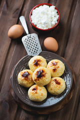 Cottage cheese pancakes and ingredients, high angle view
