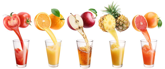 Fresh juice pours from fruits and vegetables in a glass.