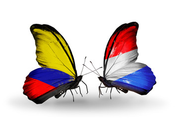 Two butterflies with flags Columbia and Luxembourg