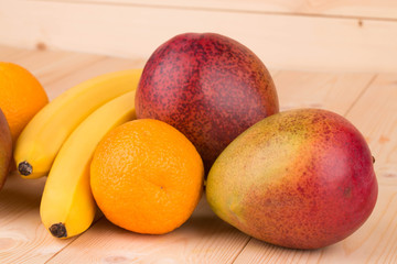 Ripe mangoes and citrus fruits.
