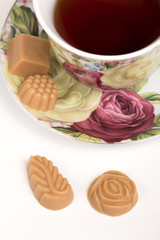 Cup of tea with candies
