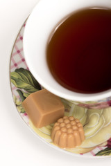 Cup of tea with candies