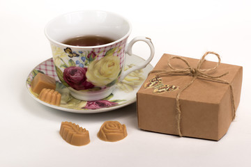 Cup of tea with candies