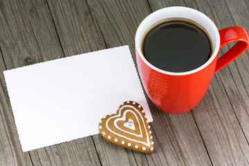 Cup of coffee and heart shape cookie