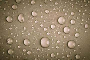 Drops of water on the colored background