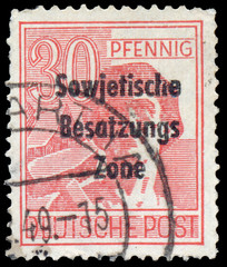 Stamp printed in Germany shows worker with hammer