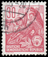 Stamp printed in GDR, shows a Folk dance group