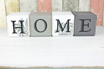Home sign on a distressed wood background