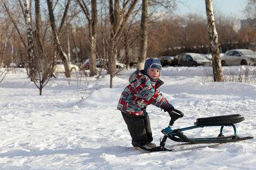 Boy with a snow racer
