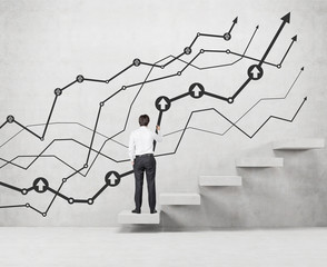 businessman drawing chart